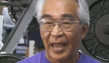Tommy Kono with weightroom in background